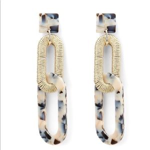 Express interlocking drop earrings.